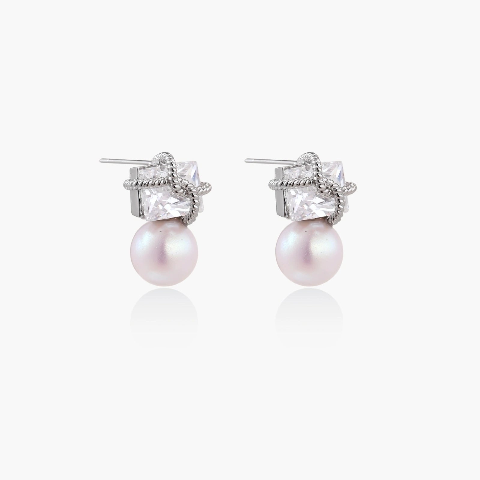 White gold stud earrings with square crystal stones in twisted frames and pink freshwater pearl drops below