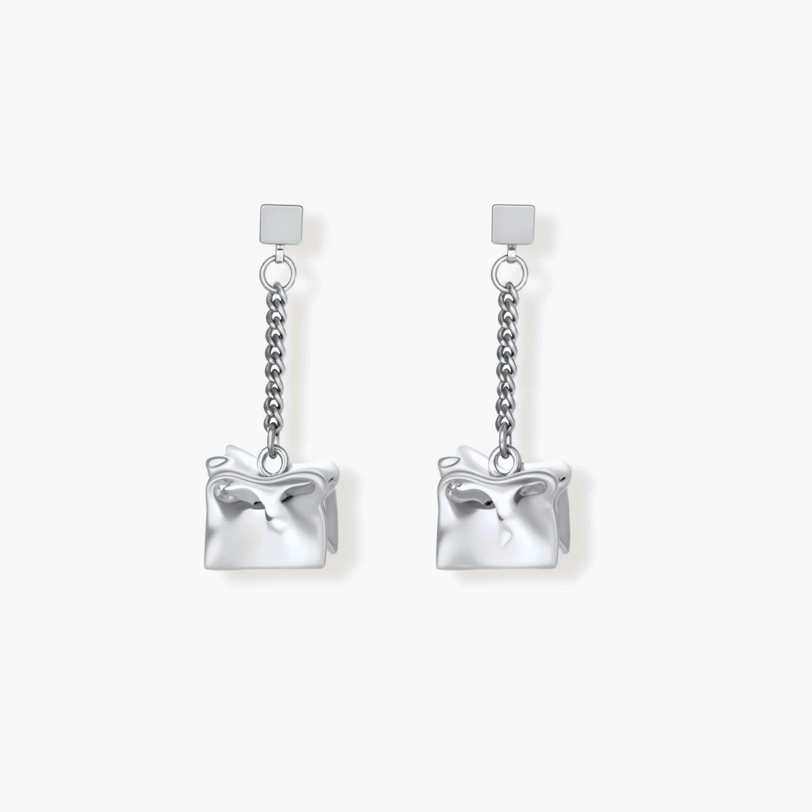 Geometric jewelry set with textured cube pendants on chains, featuring eco-zinc alloy in silver and gold finishes.