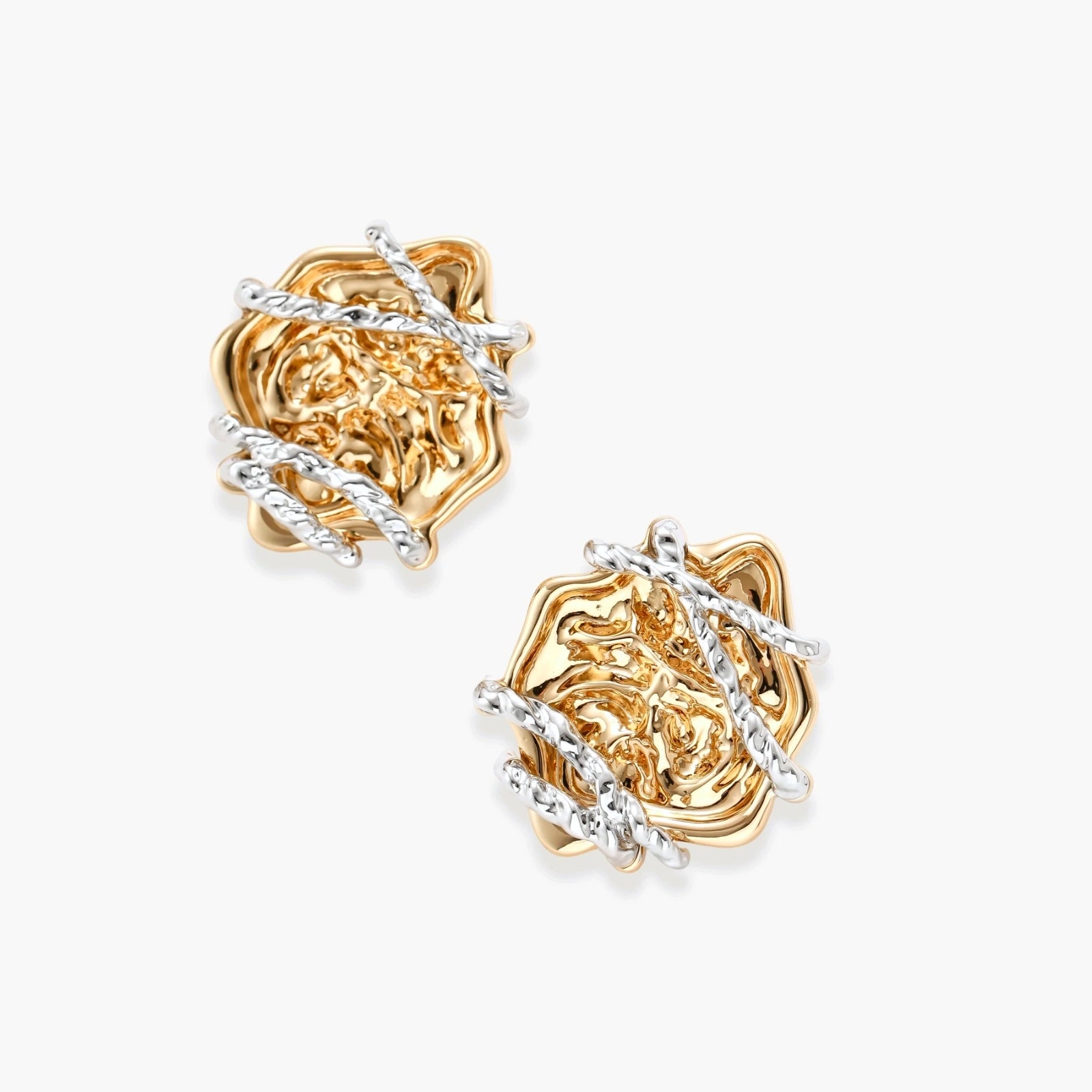 Sculptural rose-shaped stud earrings in gold with silver wire details and S925 posts on cream background.