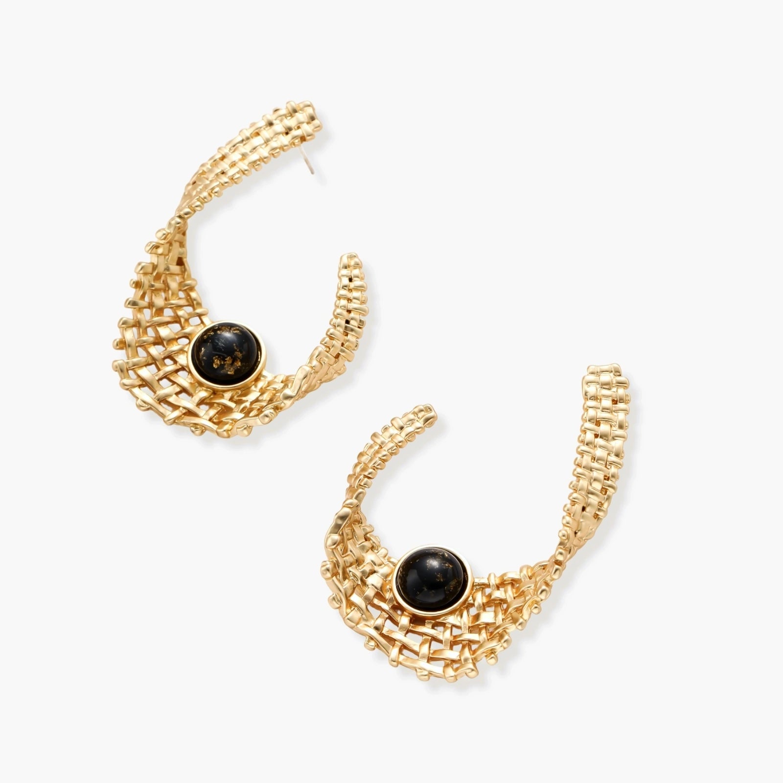 Gold-tone sculptural earrings with interwoven mesh design and black resin stone accents on white background.